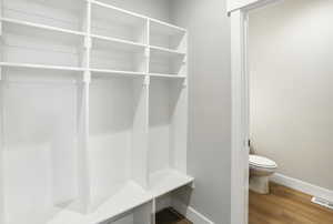 Mudroom with baseboards and wood finished floors