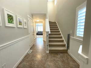 Staircase with a wainscoted wall