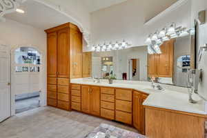 Full bathroom featuring double vanity