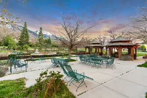 Patio terrace at dusk with a gazebo