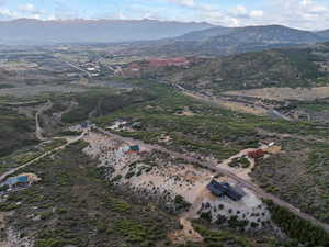 Aerial view of property's location with mountains and rural landscape