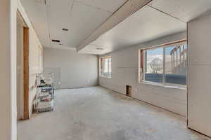 Empty room with unfinished concrete floors