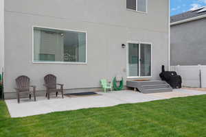 Rear view of house with a patio area