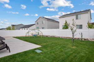 View of yard featuring a playground and rock landscaping