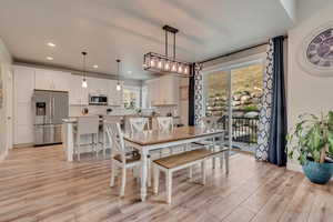 Dining area featuring light wood-style flooring, recessed lighting, and baseboards