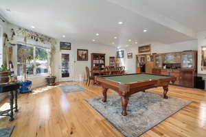 HUGE great room featuring billiards, light wood finished floors, baseboards, and recessed lighting