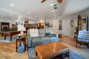 Living area with billiards table, ceiling fan, light wood-style flooring, recessed lighting, and baseboards