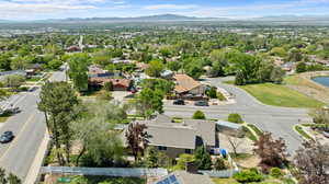 Aerial perspective of suburban area with a mountain backdrop