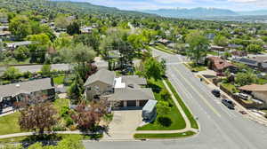 Aerial perspective of suburban area featuring a mountainous background