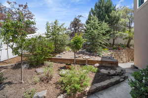 View of yard featuring fence
