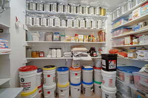 This is actually the mainfloor primary closet, being used for storage