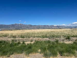 View of mountain backdrop with rural landscape