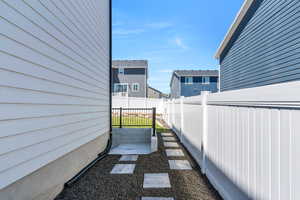 View of yard featuring fence