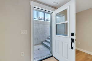 Bathroom with wood finished floors and baseboards