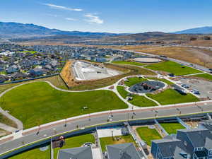 Aerial view of residential area featuring a mountainous background