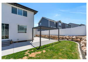 View of yard featuring a pergola and a patio area