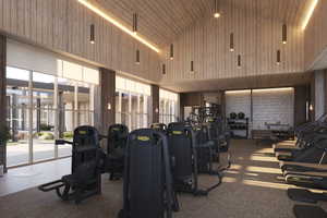 Workout area with high vaulted ceiling