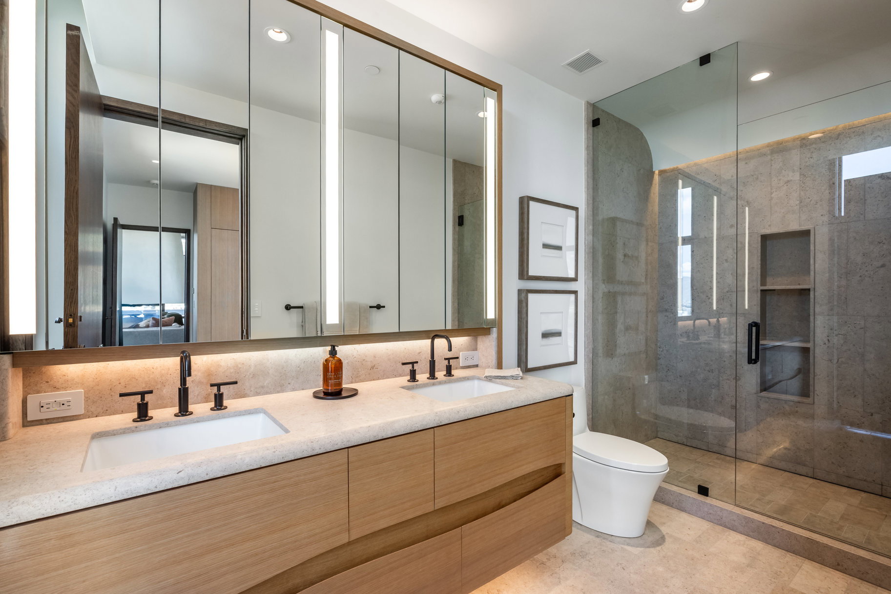 Full bath featuring toilet, a stall shower, double vanity, and recessed lighting