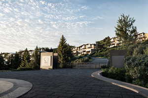View of patio / terrace with a residential view, fence, and a gate