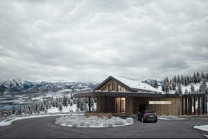 Snow covered property featuring a mountain view
