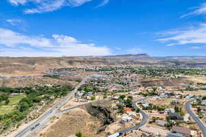 Aerial perspective of suburban area featuring a mountain backdrop