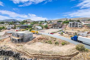 Aerial perspective of suburban area featuring a mountain backdrop