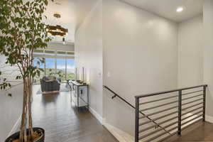 Entryway, leads to the amazing views of the valley and mountains, staircase featuring ceiling fan, wood finished floors, and recessed lighting