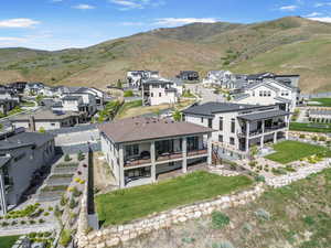 Aerial perspective of suburban area featuring a mountainous background