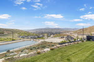 Aerial view of a mountain backdrop and a pool
