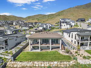 Aerial perspective of suburban area with a mountain backdrop