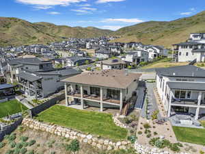 Aerial view of residential area featuring a mountain backdrop