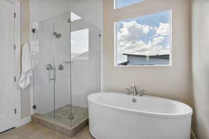 Master bathroom with separate shower and high-end tub, heated floor