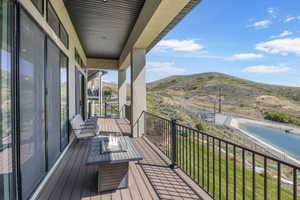Balcony featuring an outdoor fire pit and a mountain view
