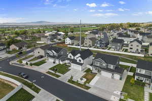 Aerial perspective of suburban area with a mountainous background
