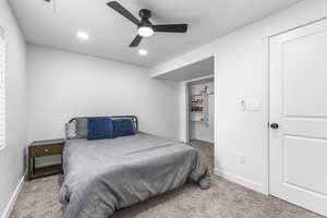 Carpeted bedroom featuring recessed lighting, baseboards, and a ceiling fan
