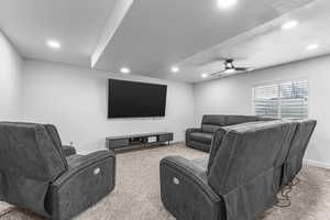 Cinema room with carpet floors, recessed lighting, baseboards, and a ceiling fan