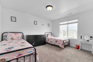 Bedroom with carpet floors and baseboards