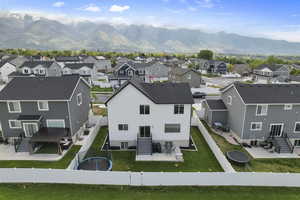 Aerial view of residential area featuring mountains
