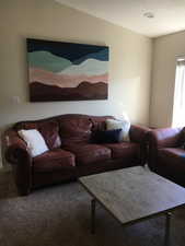 Living area with carpet flooring