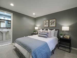 Carpeted bedroom featuring a sink, baseboards, connected bathroom, and recessed lighting