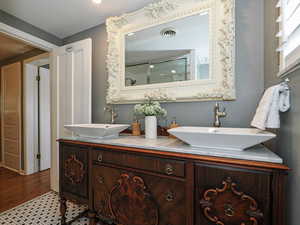 Full bathroom featuring double vanity