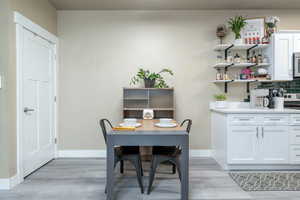 Dining room with new LVP flooring and baseboards
