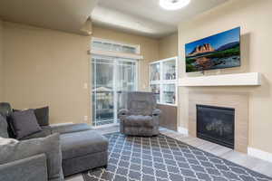 Living area featuring new LVP flooring and a tile fireplace