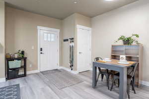 Entrance foyer with new LVP flooring and baseboards