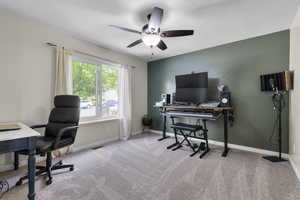 Office with a ceiling fan, carpet, and baseboards