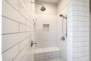 Full bathroom with a tile shower