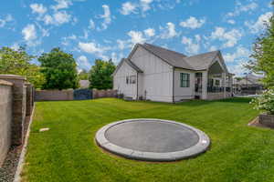 Rear view of property featuring board and batten siding