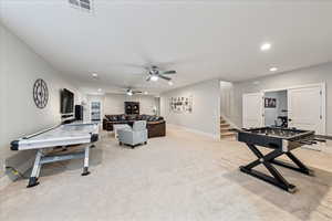 Playroom featuring carpet floors, recessed lighting, baseboards, and a ceiling fan