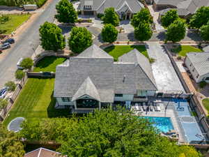 Aerial view of property and surrounding area with a pool