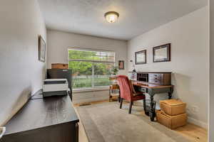 Office area featuring wood finished floors and baseboards